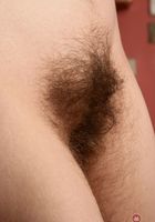 Amber squats down and spreads her hairy kitty., Amber (amb041) ATK Natural & Hairy: Amber (Amber squats down and spreads her hairy kitty.)
