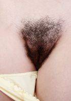 Emma leans back spreading wide., Emma Evins (emm030) ATK Natural & Hairy: Emma Evins (Emma leans back spreading wide.)
