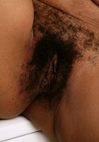 Issabella shows off her ebony body and generous body hair., Issabella (iss002) ATK Exotics: Issabella (Issabella shows off her ebony body and generous body hair.)